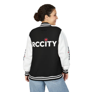 Person wearing a black and white letterman jacket with 'RCCITY' printed on the back.