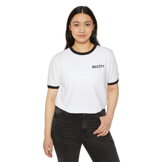 Person wearing a white t-shirt with 'RC CITY' logo