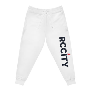White sweatpants with 'RCCITY' printed on the side against- RC city