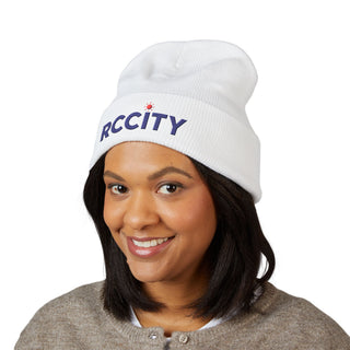 Person wearing a white beanie with 'RCCITY' 