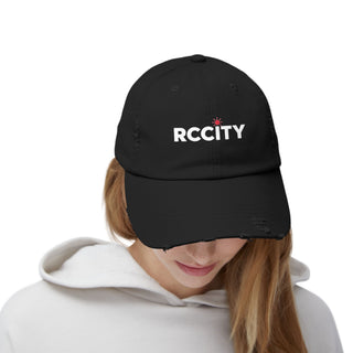 Person wearing a black cap with 'RCCITY' logo - RC city