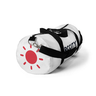 White duffel bag with black straps and a red sun design - RC city