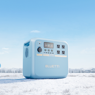Blue BLUETTI power station in a snowy landscape