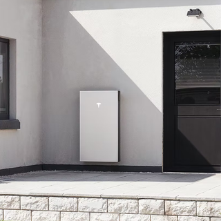 Tesla Powerwall 3 installed on garage wall