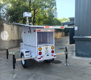 mobile solar trailer on a back of a building 